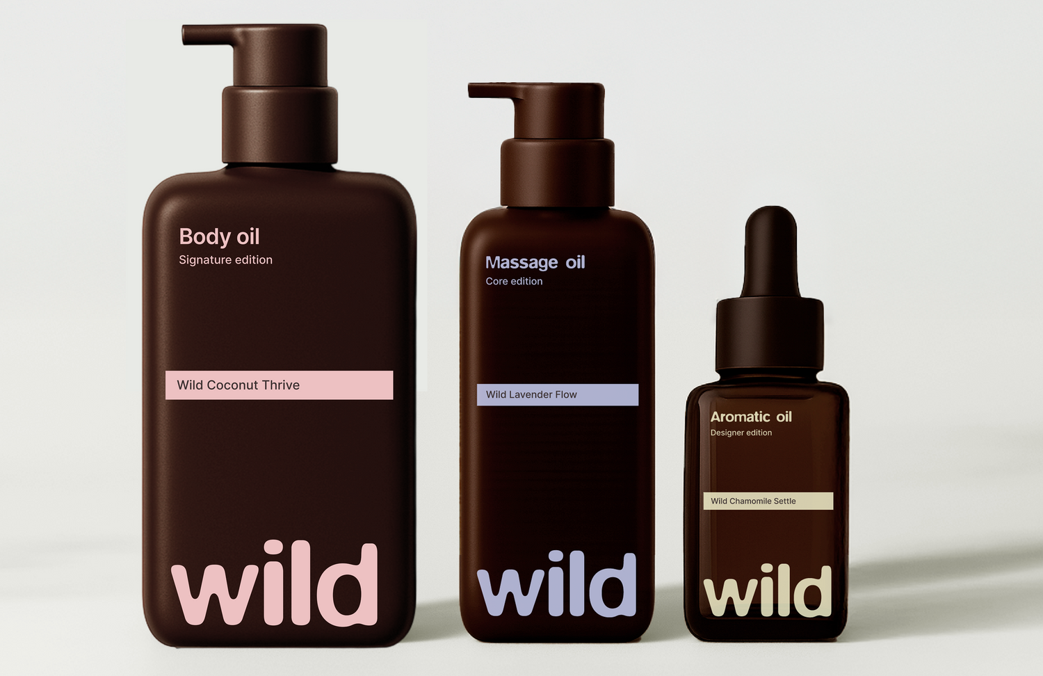 Three bottles of 'wild' body and massage oils on a white background